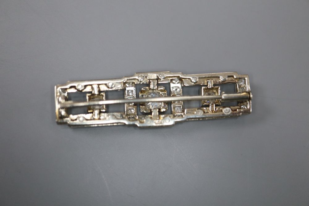 An Art Deco style 585 white and yellow metal, diamond cluster set rectangular bar brooch, 4cm, gross 7.1 grams, makers mark, RR.